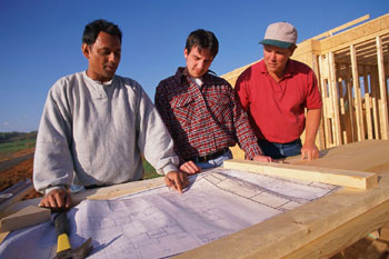Men Looking at Blueprints